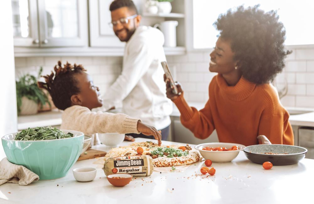 Family together in the kitchen, protected by life cover
