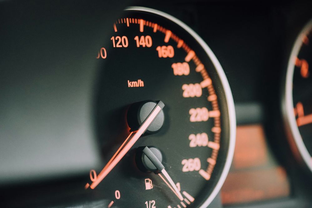 Car dashboard speedometer, representing motor insurance cover