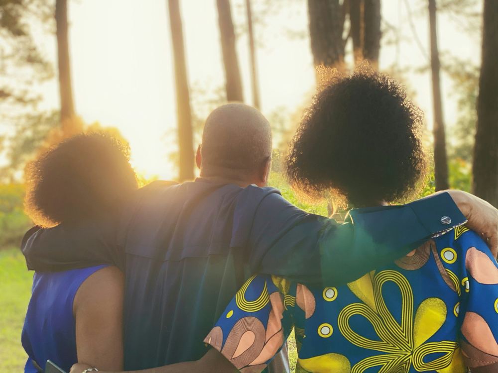 Couple embracing at sunset, planning a dignified retirement